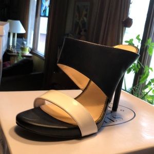 Black and white leather mules heels
